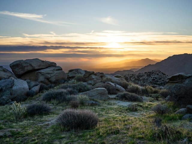 Desert boulders at golden hour under a wide open sky